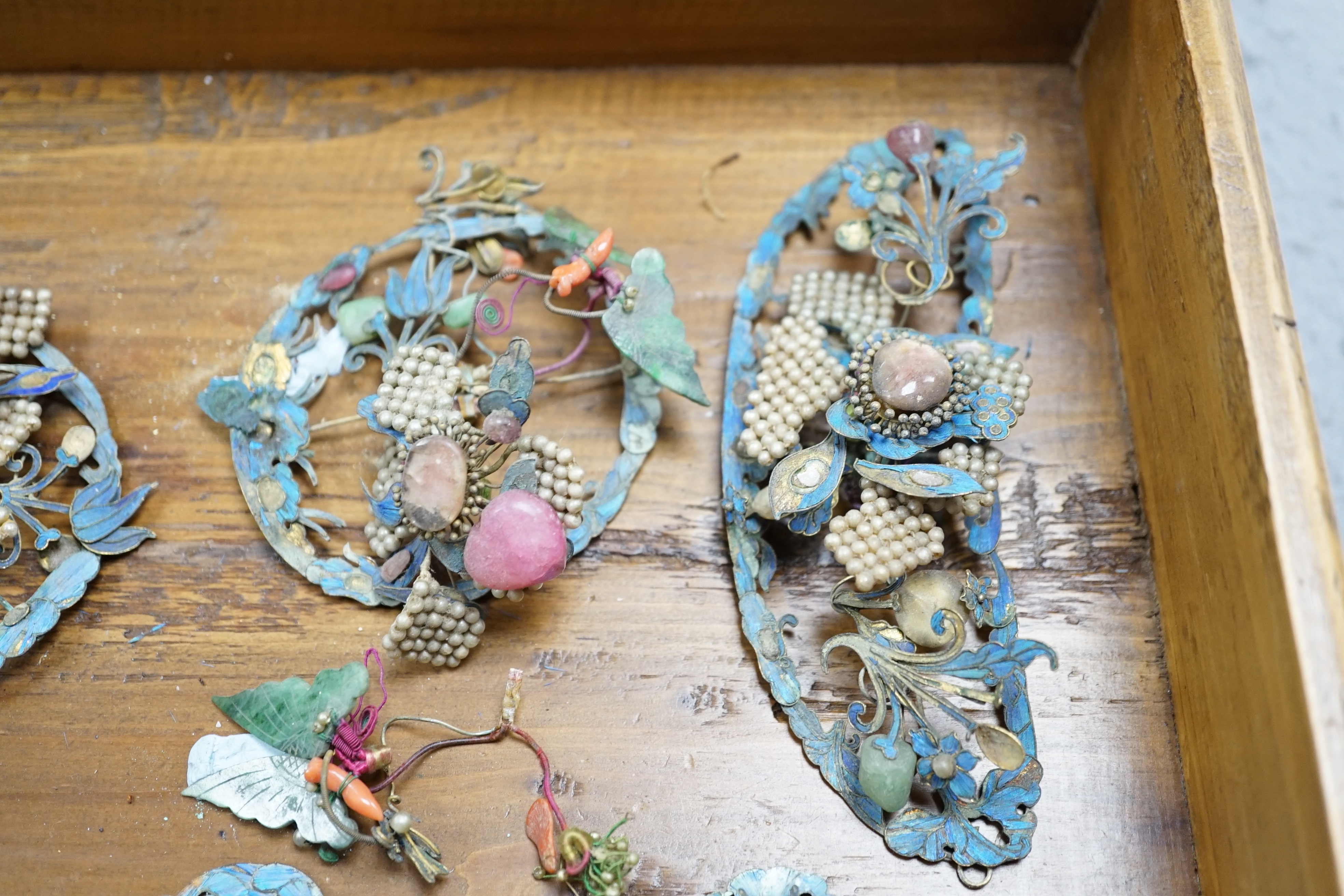 A group of eight Chinese kingfisher feather, jade, seed pearl, coral and hardstone mounted headdresses and ornaments, late Qing dynasty, some losses